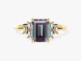 Emerald cut alexandrite ring with baguette diamonds on gold band