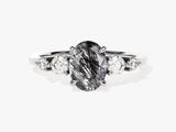 Oval rutilated quartz and diamond engagement ring