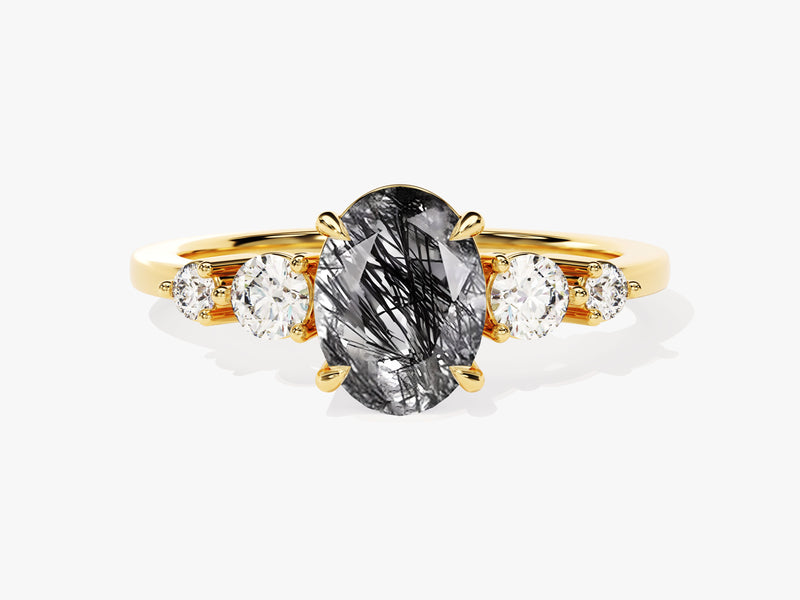 Gold ring with oval rutilated quartz and diamonds