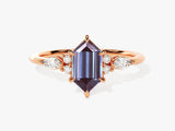 Hexagonal alexandrite ring with pear-shaped diamonds, rose gold setting