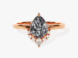 Rose gold ring with pear-cut rutilated quartz and diamond accents