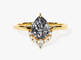 Gold ring with pear-cut rutilated quartz and diamond accents