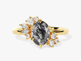 Gold ring with oval rutilated quartz and diamond accents