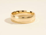 Textured gold wedding band jewelry from a jewelry firm
