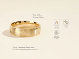 Gold wedding band with brushed finish and diagonal lines
