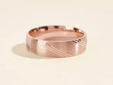 Rose gold brushed ring with diagonal etched lines jewelry