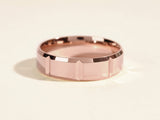 Rose gold faceted band ring for jewelry collection