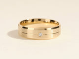 Gold wedding band with diamond accent, jewelry